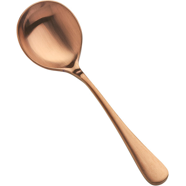 A Bon Chef matte rose gold bouillon spoon with a handle and a bowl.