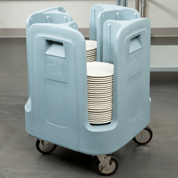 A blue Metro "Poker Chip" dish cart full of plates.