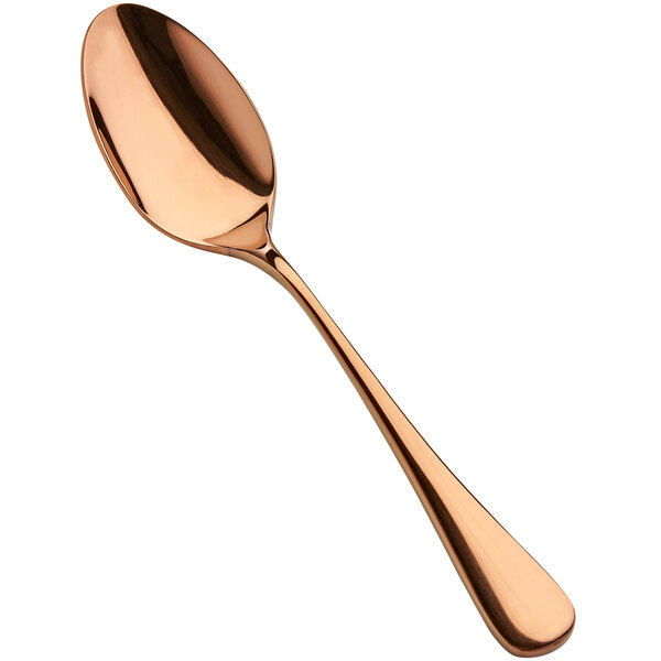 A close-up of a Bon Chef rose gold soup/dessert spoon with a stainless steel bowl.