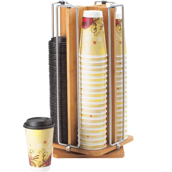 A Cal-Mil bamboo cup and lid organizer holding cups and lids.