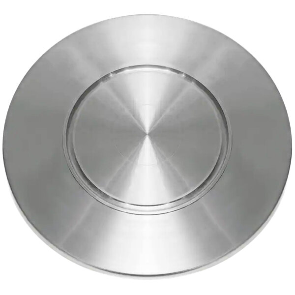 A silver circular plate with a circular design in the center.