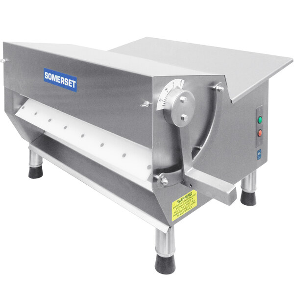 A Somerset Countertop Dough Sheeter with a white label and a handle.