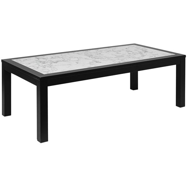 A black aluminum coffee table with a Carrara marble top.