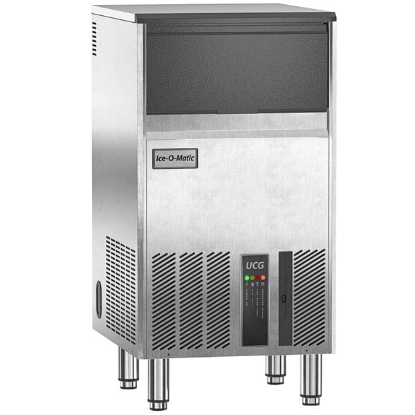 An Ice-O-Matic stainless steel undercounter ice machine with black accents.