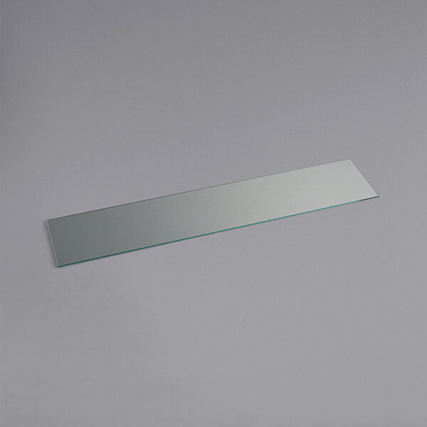 A rectangular glass panel with a silver edge.