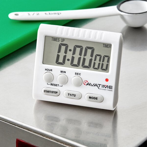A white AvaTime digital kitchen timer on a metal surface.