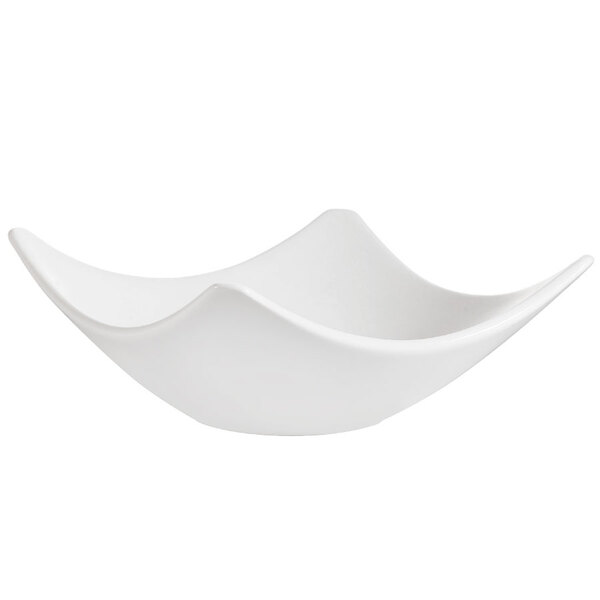 A CAC white porcelain square bowl with a wavy edge.