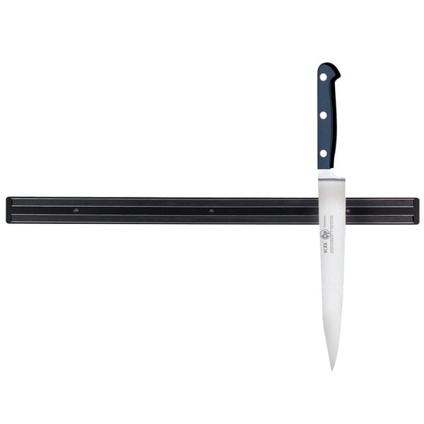 A Tablecraft black magnetic knife holder with a knife on it.