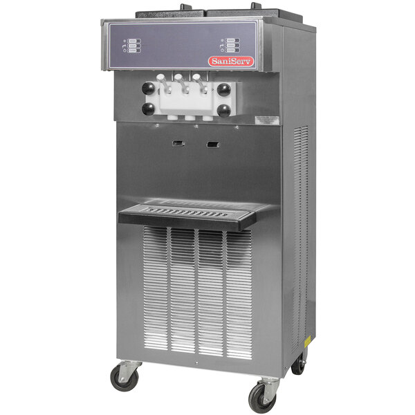 A stainless steel SaniServ water cooled soft serve ice cream machine with white and black handles.