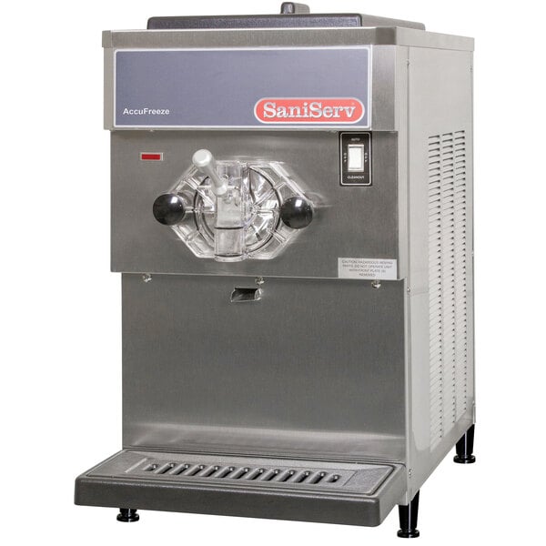 A SaniServ commercial soft serve ice cream machine with a stainless steel finish and a handle.