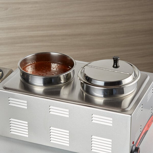 A stainless steel Vigor steam table adapter with 2 bowls of sauce on top.