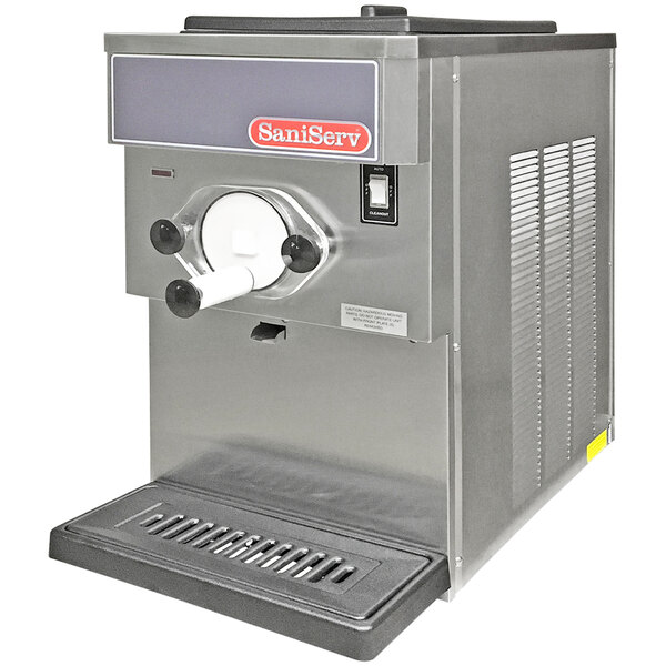A SaniServ commercial countertop shake machine with a stainless steel finish and a lid.
