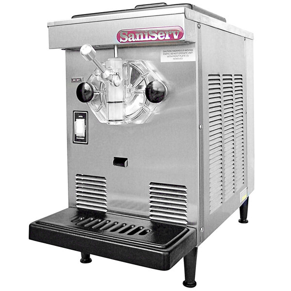 A silver SaniServ countertop ice cream machine with a black handle.