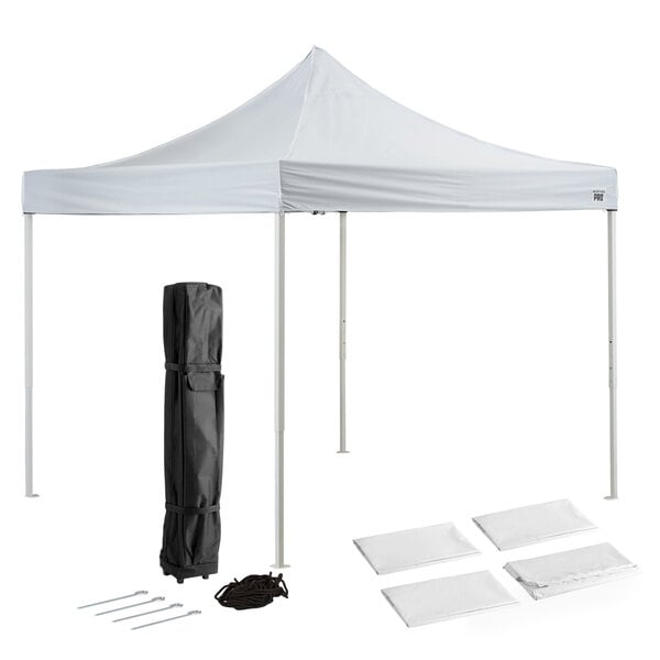 A white tent with a black bag and poles.