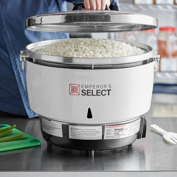 A pot of rice steaming in an Emperor's Select gas rice cooker.