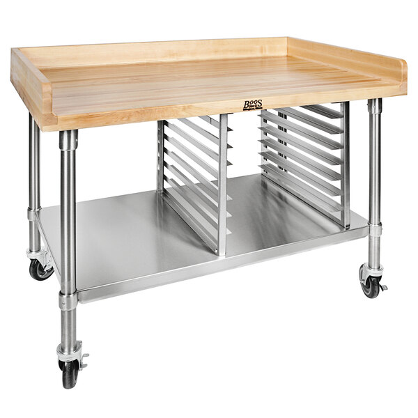 A John Boos wood top work table with a stainless steel base and undershelf on wheels.