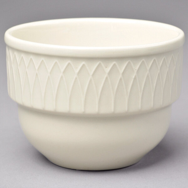 A close up of a Homer Laughlin ivory china bowl with a pattern on it.