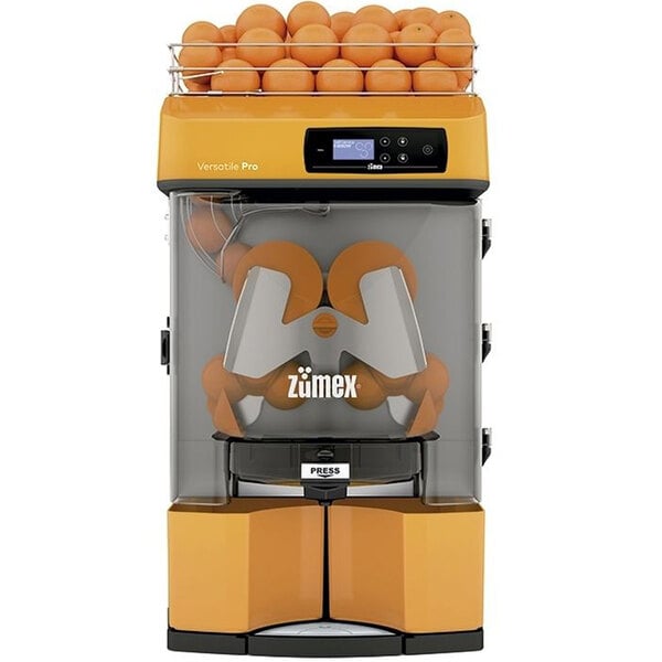 A Zumex automatic feed juicer with oranges inside.