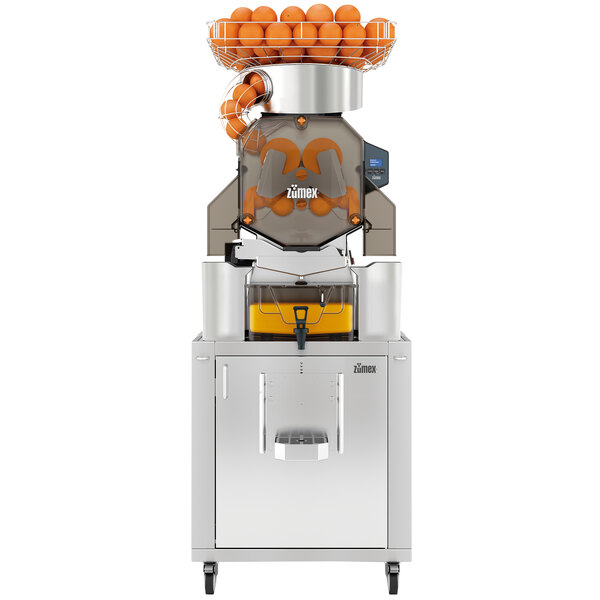 A Zumex Speed S+ juicer with oranges on top.