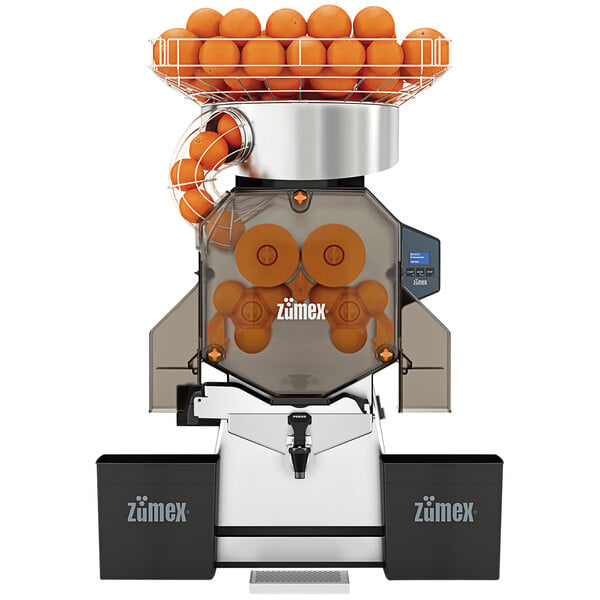 A Zumex Speed Up juicer with oranges inside.