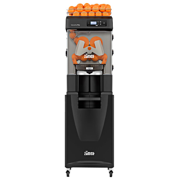 A black Zumex Versatile Pro juicer with oranges in it.