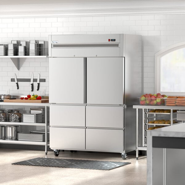 An Avantco stainless steel reach-in refrigerator with bottom drawers in a professional kitchen.