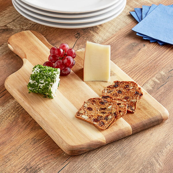 A Tablecraft rectangular acacia wood serving board with cheese and grapes.