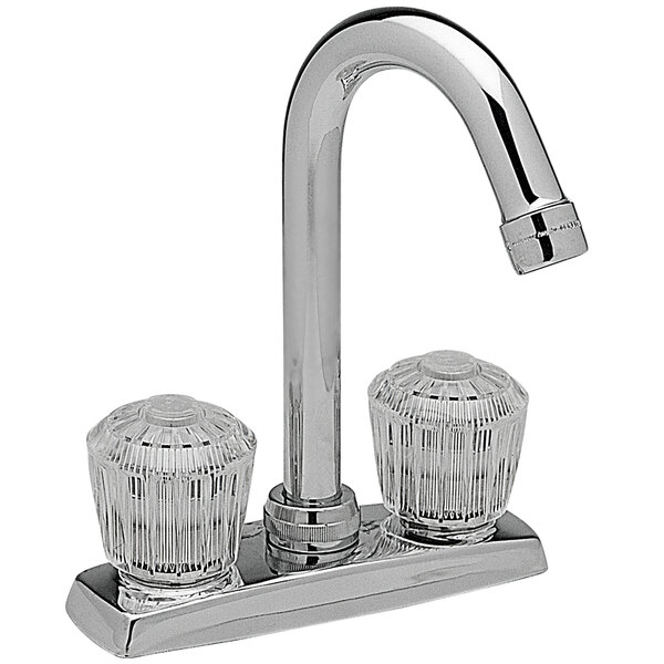 A close-up of a chrome Elkay deck-mount faucet with clear crystalac handles.