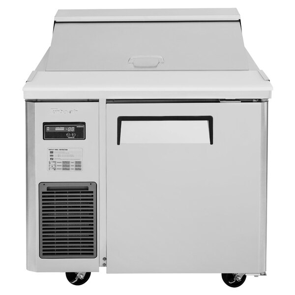 A white Turbo Air refrigerated sandwich prep table with a door open.