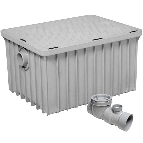A grey plastic Endura grease trap with 3" threaded connections.