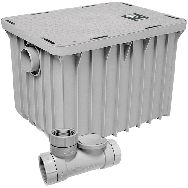 An Endura grey plastic 40 lb. grease trap with 2" threaded connections.