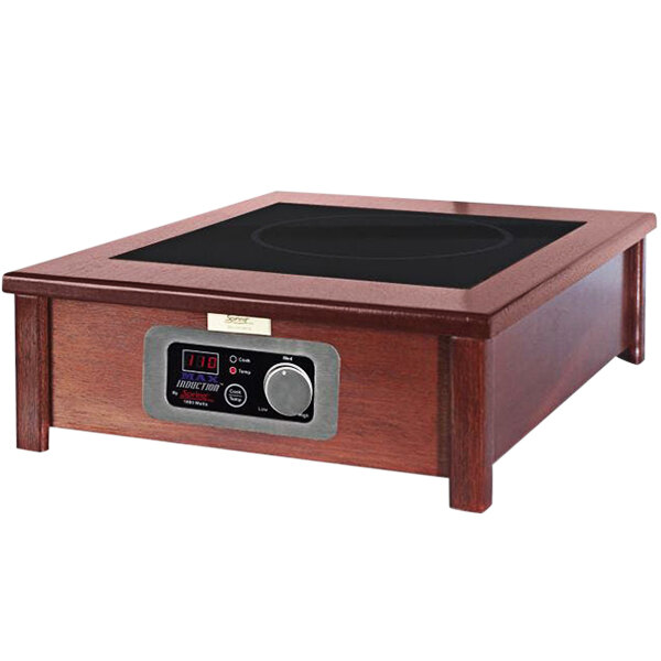 A Spring USA MAX induction range with a black and silver control panel in a wood square countertop.