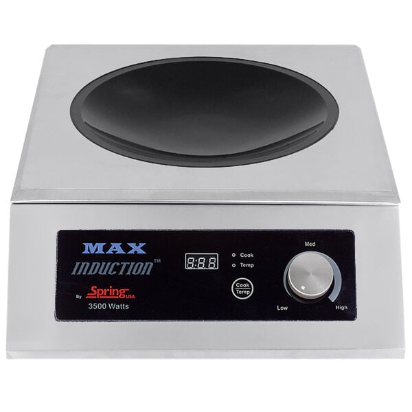 A Spring USA stainless steel countertop induction wok range with a black and white digital timer.