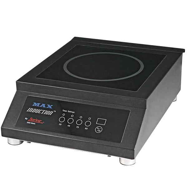 A black Spring USA MAX Induction Range on a countertop with buttons and a screen.