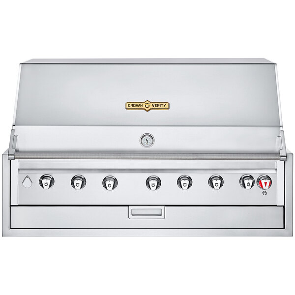 A stainless steel Crown Verity built-in grill with four burners and knobs on a counter.