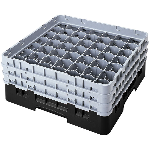 A black plastic Cambro glass rack with 49 compartments and 4 extenders.