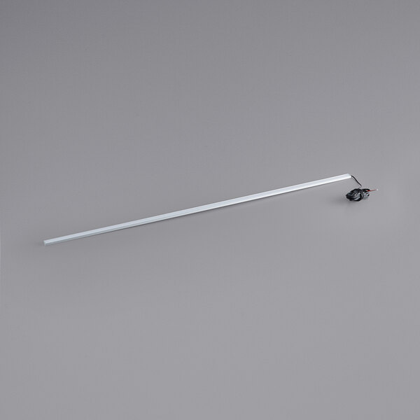An Avantco LED light fixture with a long metal rod and wire.