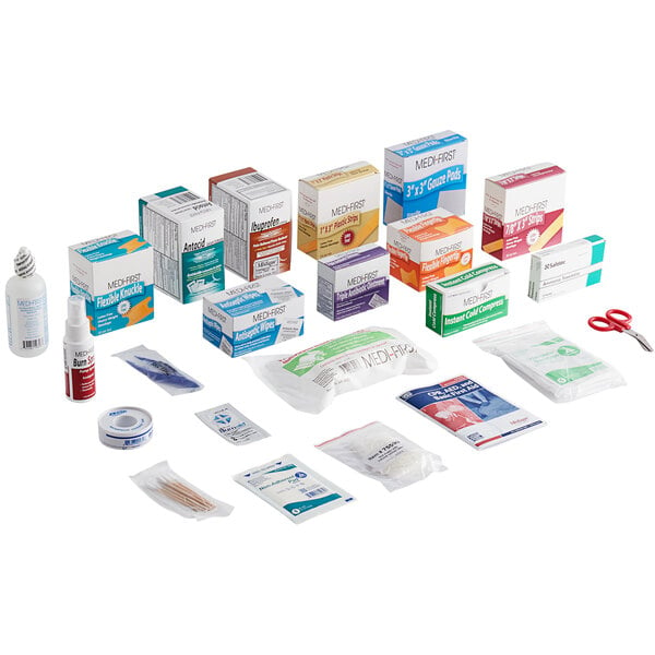 A Medique first aid kit refill with various first aid supplies inside.