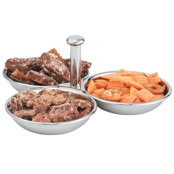 A Vollrath stainless steel condiment server with three bowls of food.