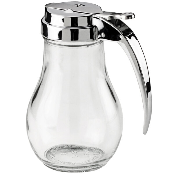 A Vollrath glass jar with a metal handle.