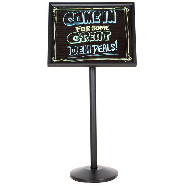 A black Aarco single pedestal sign with white writing on it.