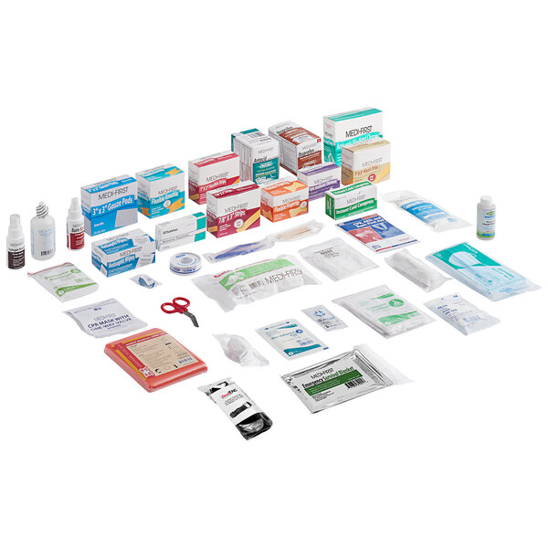 A Medique first aid kit refill package on a white surface.