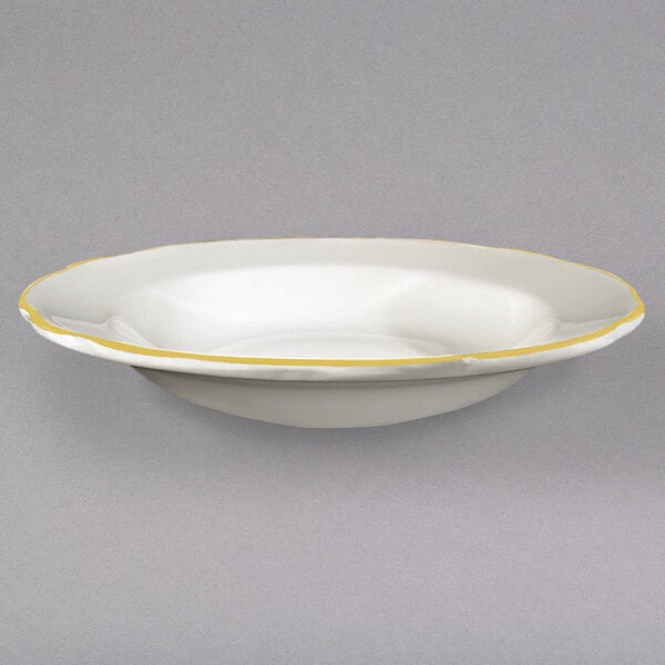 A white bowl with a yellow rim.