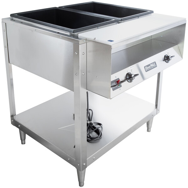 A Vollrath stainless steel hot food table with two pans on it.