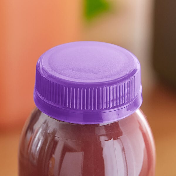 A bottle of liquid with a Purple Tamper-Evident Cap on the counter.