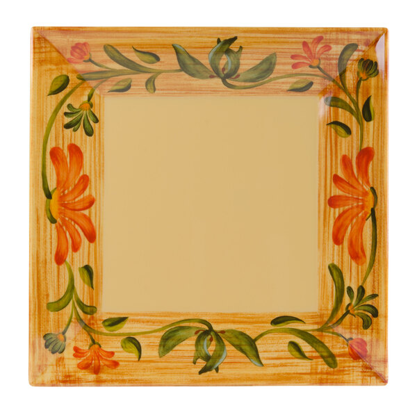 A square plate with a painted floral design including flowers and a yellow border.