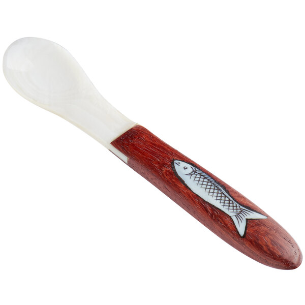A Bemka Mother of Pearl caviar spoon with a wood handle with a fish design.