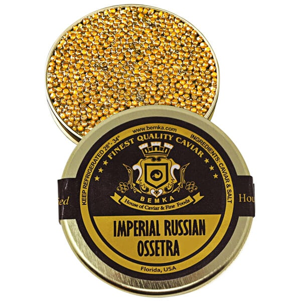 A round metal container of Bemka Imperial Russian Ossetra Sturgeon Caviar with a black label and gold beads.