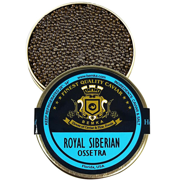 A can of Bemka Royal Siberian Ossetra Sturgeon Caviar on a table with a label.