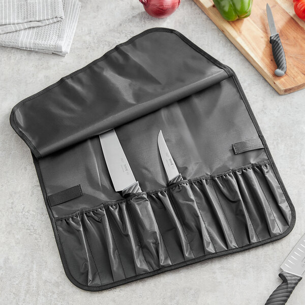 A Schraf knife roll with 10 black pockets holding knives.